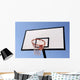 Outdoor basketball hoop against the blue sky Wall Mural