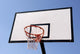 Outdoor basketball hoop against the blue sky Wall Mural