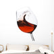 Isolated moving (motion blur) red wine glass Wall Decal