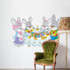 Easter bunnies at the festive table Wall Decal