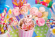 birthday party table with marshmallow pops and other sweets for 