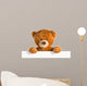 teddy bear behind whiteboard 