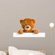 teddy bear behind whiteboard 