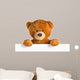 teddy bear behind whiteboard 