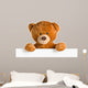 teddy bear behind whiteboard 