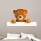 teddy bear behind whiteboard 