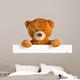 teddy bear behind whiteboard 