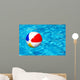 Beach ball in swimming pool Wall Mural