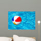 Beach ball in swimming pool Wall Mural