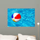 Beach ball in swimming pool Wall Mural