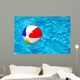 Beach ball in swimming pool Wall Mural