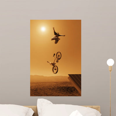 Cyclist Going off Jump Wall Mural shown on a wall