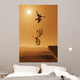 Cyclist Going Off Jump Into Water In Brown Tones Wall Mural