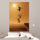 Cyclist Going Off Jump Into Water In Brown Tones Wall Mural