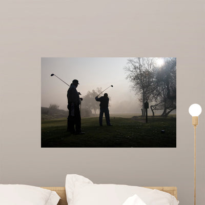 Early Morning Golfers Silhouetted shown on a wall
