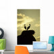 white storks on nest on rock at sunset Wall Mural