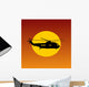 Helicopter Flying Passing Sun at Sunset Wall Mural