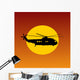 Helicopter Flying Passing Sun at Sunset Wall Mural