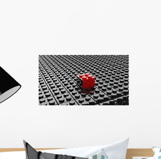 Black lego background with one red block standing out 