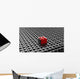Black lego background with one red block standing out 