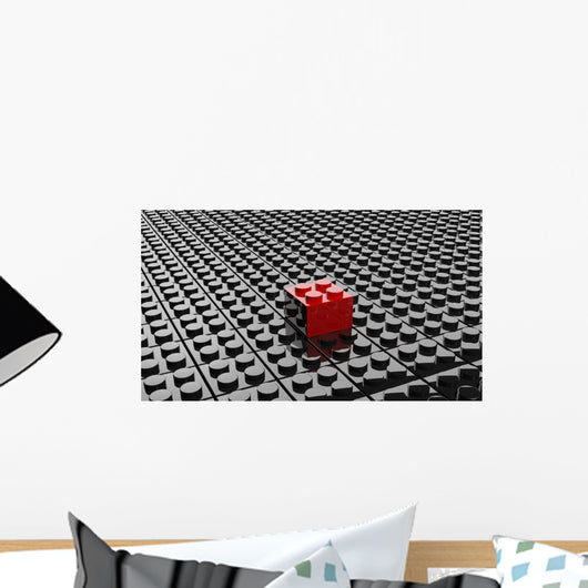Black lego background with one red block standing out 