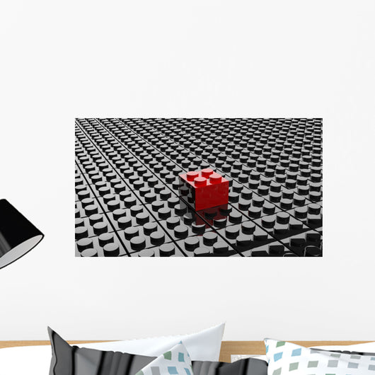 Black lego background with one red block standing out 