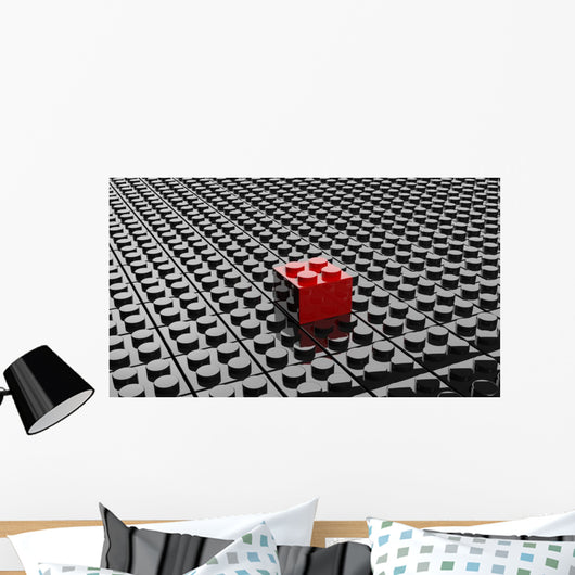 Black lego background with one red block standing out 