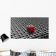 Black lego background with one red block standing out 