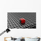 Black lego background with one red block standing out 