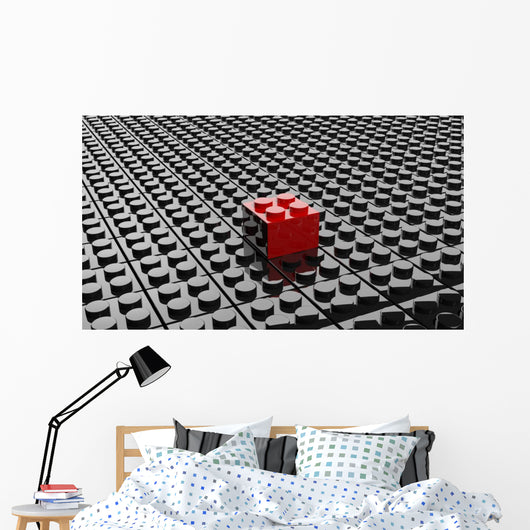 Black lego background with one red block standing out 