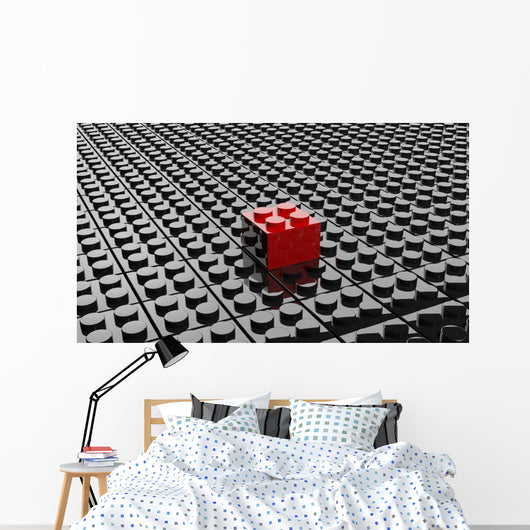 Black lego background with one red block standing out 