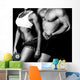 Strong woman and man against a black background Wall Mural