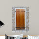 Large wooden shutters in a stone wall 