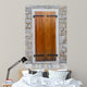 Large wooden shutters in a stone wall 