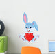 Cute rabbit holding red hat Wall Decal