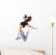 pretty modern slim hip-hop style teenage girl jumping dancing 