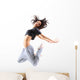pretty modern slim hip-hop style teenage girl jumping dancing 