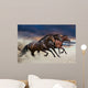 Horses running at a gallop along the sandy field Wall Mural