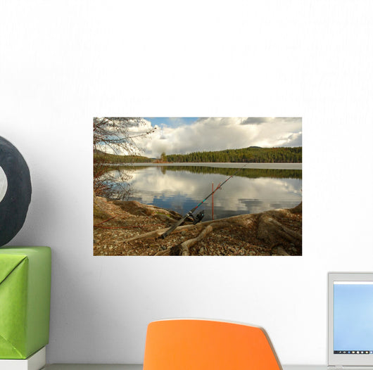 Fishing Rod Placed on the Ground near a  Lake Outdoors at a Recr Wall Mural