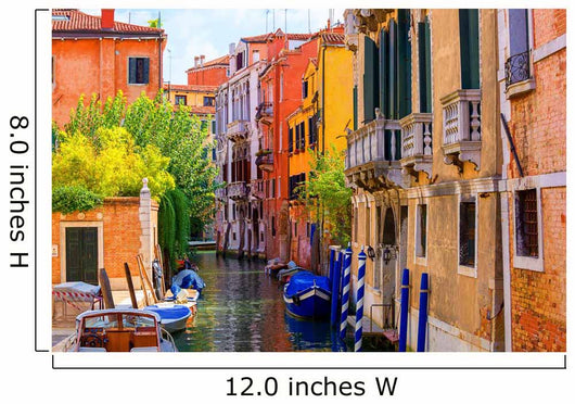 multicolored houses astride one of Venetian canals. 