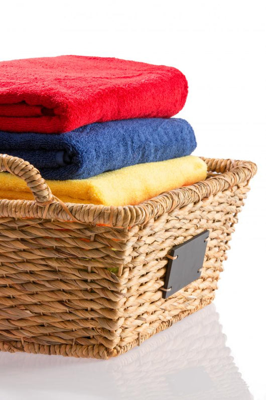 Fresh Clean Towels in a Wicker Basket 