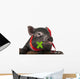 A Cute Little Black Pig Sitting in a Basket Wall Decal