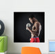 Confident young man shirtless portrait training with dumb-bell a Wall Mural