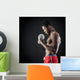 Confident young man shirtless portrait training with dumb-bell a Wall Mural
