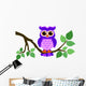 Cute Owl Sitting on a Branch 