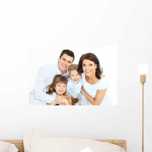 Beautiful happy family - isolated over a white background 