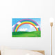 A green landscape with a rainbow in the sky Wall Mural