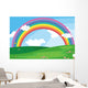 A green landscape with a rainbow in the sky Wall Mural