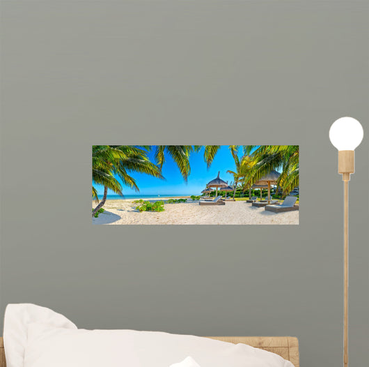 Paradise beach with palms and parasol 