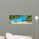 Paradise beach with palms and parasol 